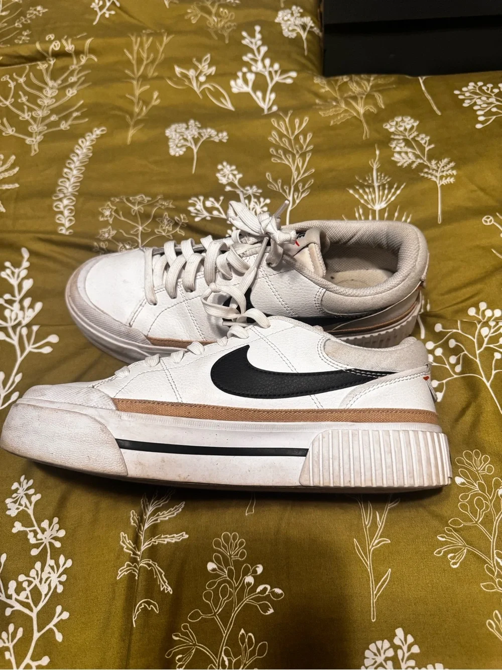 Nike Women's White Sneakers with Black Swoosh and Tan Stripe
